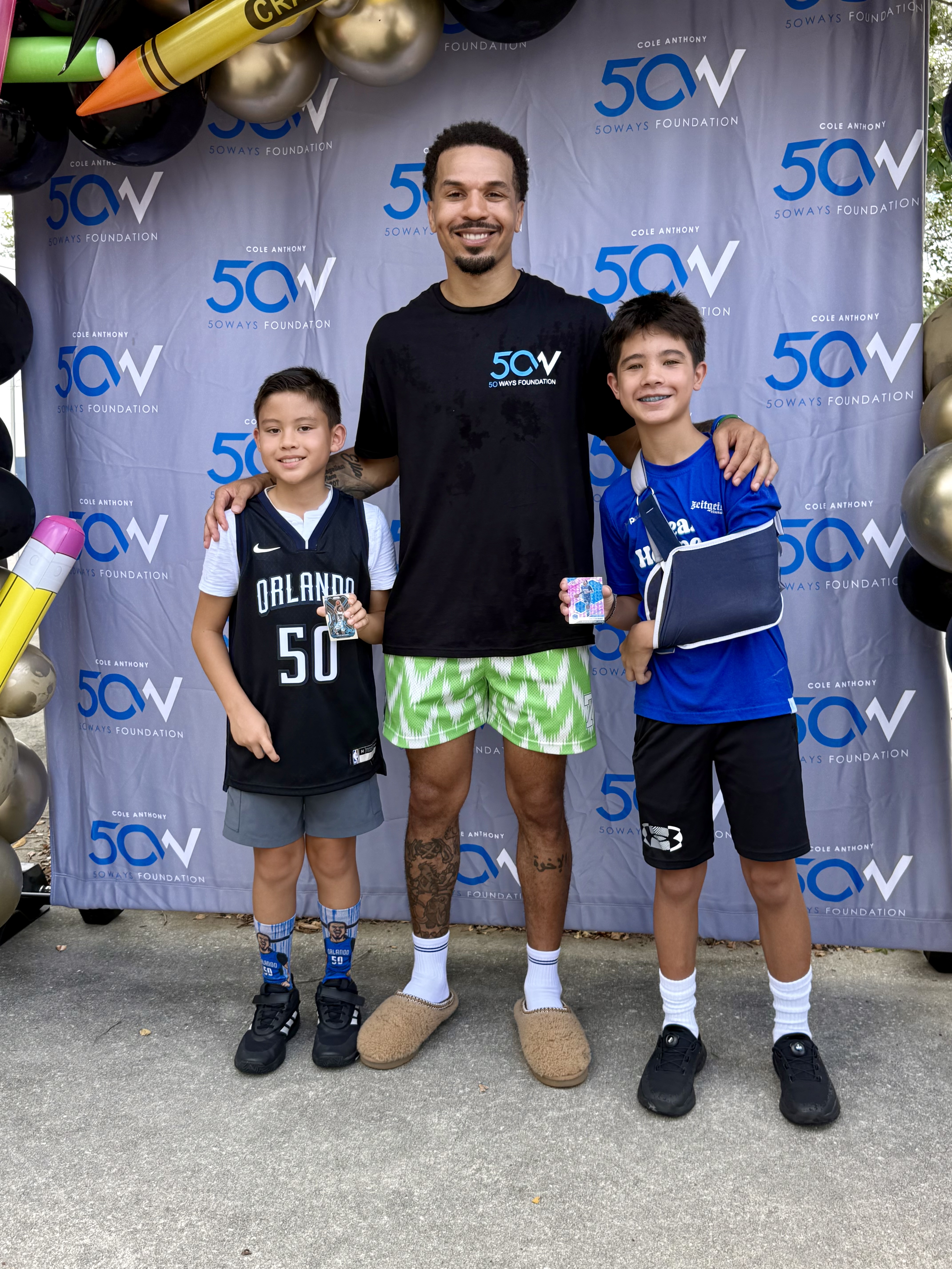 Caeden with Cole Anthony at a 50 Ways Foundation signing event