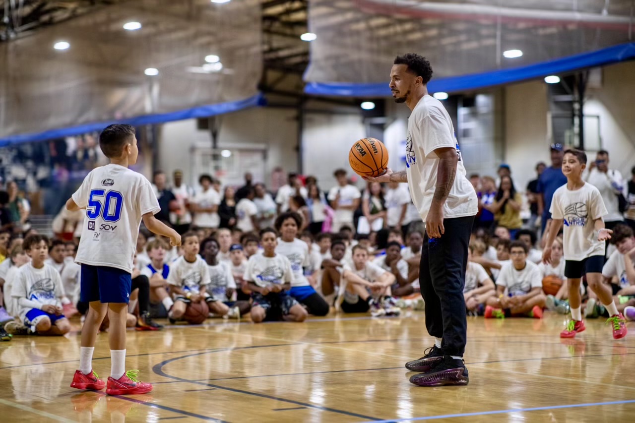 Caeden getting a pass from Cole Anthony, one on one, at his basketball camp